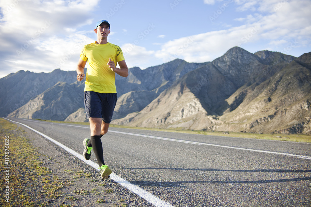 Runner on mountain road